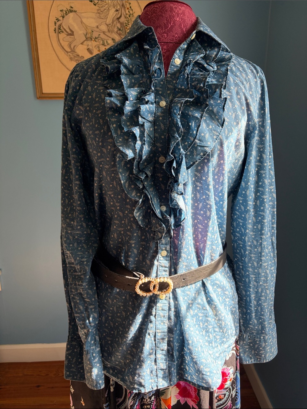 Filmy blue blouse with feather details in fabric